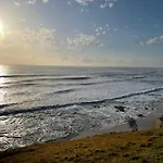 Spacious 4-Bed House Metres From Beach