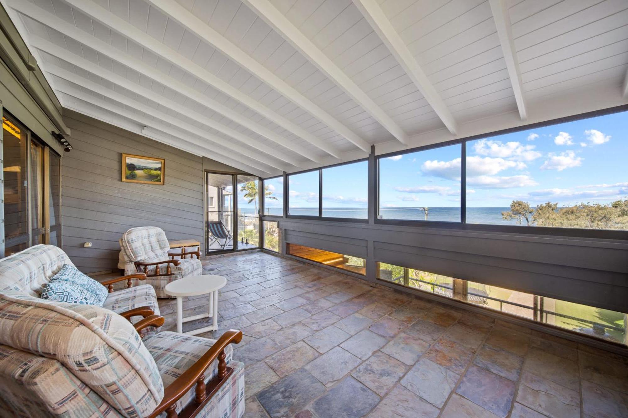 Retro House In Front Of Ocean *